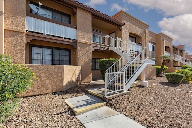 view of property featuring stairway