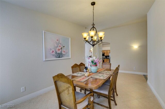 9524 Tyler Rose St, Las Vegas, NV 89178 - dining area featuring arched walkways, a chandelier, and baseboards