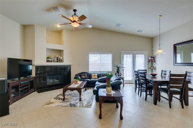 9524 Tyler Rose St, Las Vegas, NV 89178 - tiled living room with a ceiling fan, a fireplace, and lofted ceiling