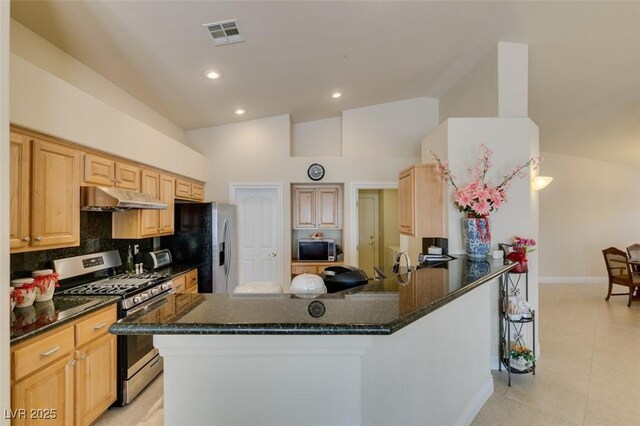 9524 Tyler Rose St, Las Vegas, NV 89178 - kitchen with stainless steel appliances, under cabinet range hood, backsplash, light tile patterned floors, and light brown cabinetry