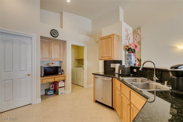 9524 Tyler Rose St, Las Vegas, NV 89178 - kitchen featuring stainless steel dishwasher, a sink, separate washer and dryer, light brown cabinetry, and high vaulted ceiling