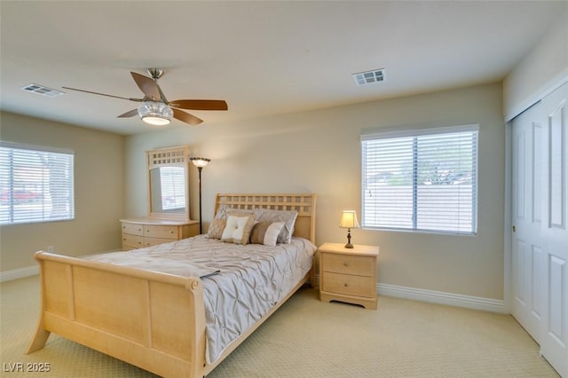 9524 Tyler Rose St, Las Vegas, NV 89178 - bedroom with baseboards, light colored carpet, a ceiling fan, and a closet