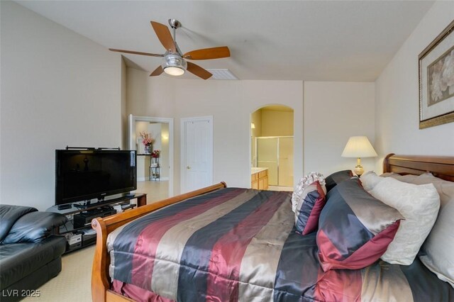 9524 Tyler Rose St, Las Vegas, NV 89178 - bedroom with arched walkways, ensuite bath, and a ceiling fan