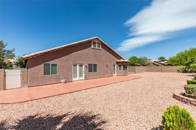 9524 Tyler Rose St, Las Vegas, NV 89178 - back of house featuring a fenced backyard, stucco siding, a gate, and a patio area