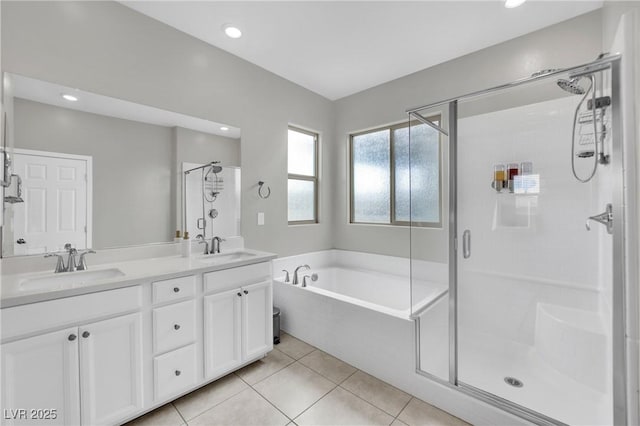bathroom featuring a shower stall, tile patterned flooring, a bath, double vanity, and recessed lighting
