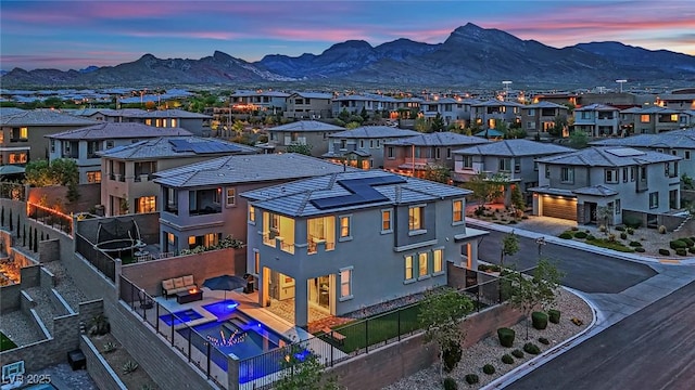 view of mountain backdrop featuring nearby suburban area