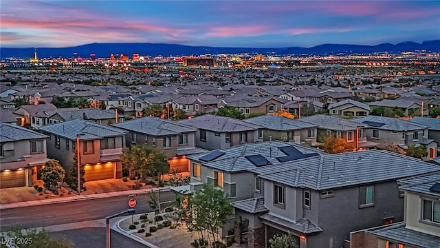 aerial view at dusk of a residential view and a mountain view