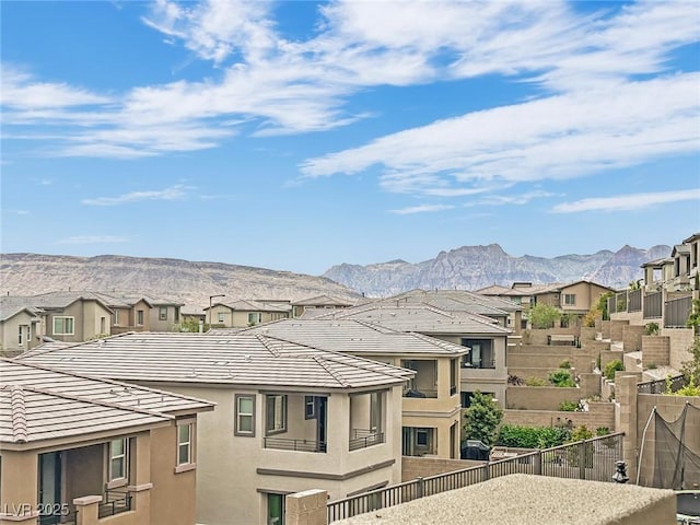 view of mountain background featuring nearby suburban area