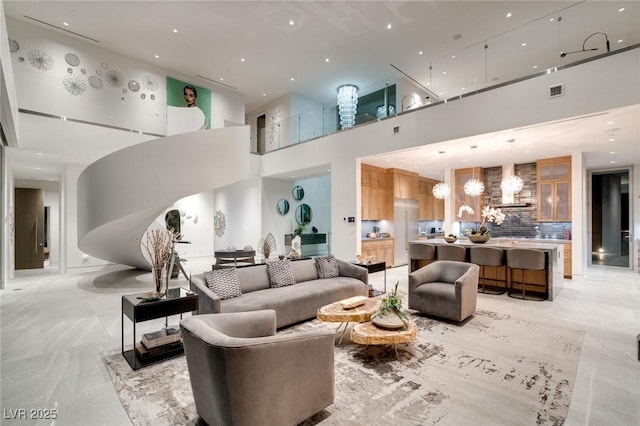 community lobby featuring a high ceiling and recessed lighting