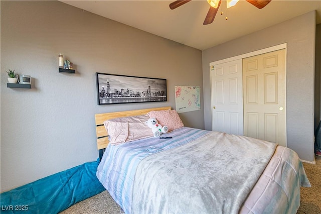 carpeted bedroom featuring a closet and ceiling fan