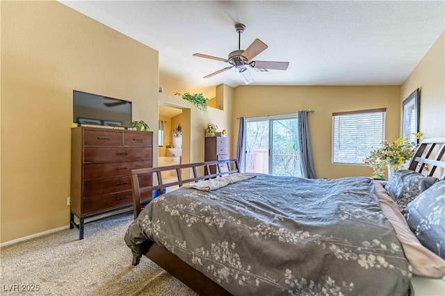 bedroom with vaulted ceiling, carpet, baseboards, and a ceiling fan