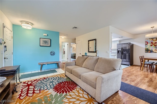 5576 W Rochelle Ave Unit 27C, Las Vegas, NV 89103 - living area featuring light wood-style flooring and baseboards