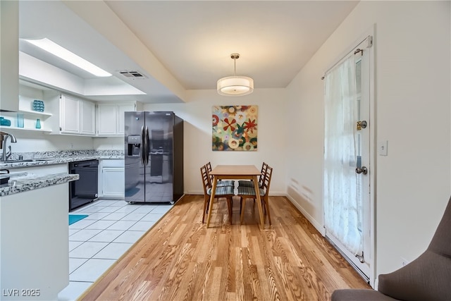 5576 W Rochelle Ave Unit 27C, Las Vegas, NV 89103 - dining area featuring light wood-style flooring