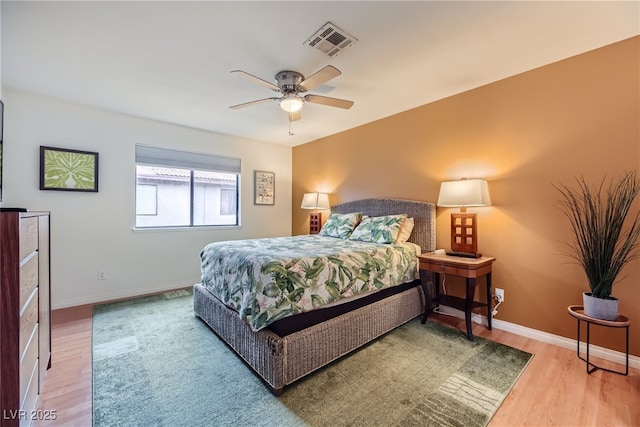 5576 W Rochelle Ave Unit 27C, Las Vegas, NV 89103 - bedroom with wood finished floors, baseboards, and a ceiling fan