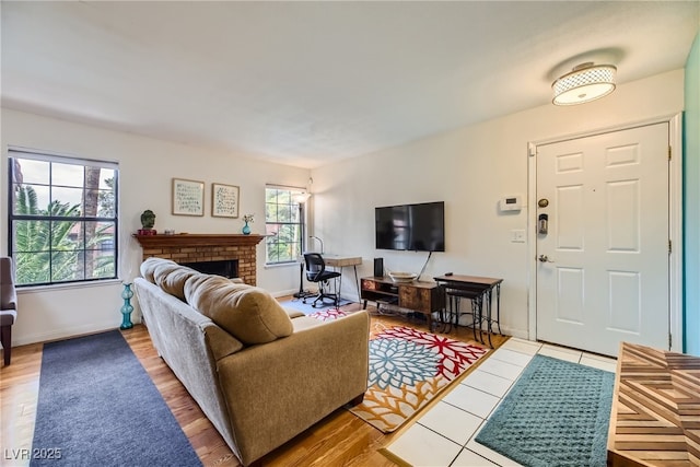5576 W Rochelle Ave Unit 27C, Las Vegas, NV 89103 - living area with a fireplace, wood finished floors, and baseboards