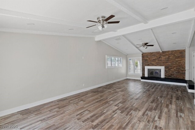 unfurnished living room with wood finished floors, a ceiling fan, a fireplace, and baseboards