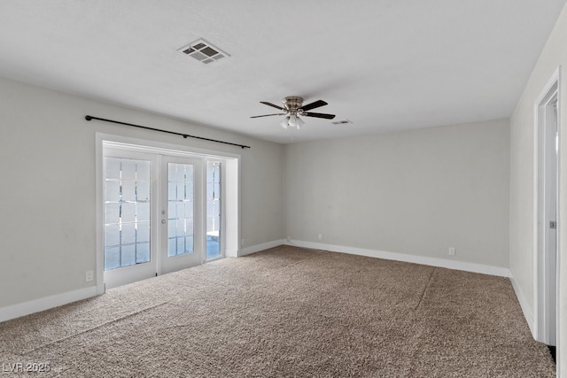 unfurnished room with a ceiling fan, carpet flooring, and baseboards