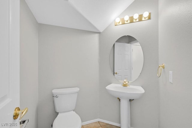 1221 Diamond Valley St, Henderson, NV 89052 - half bathroom with toilet, baseboards, tile patterned floors, and vaulted ceiling