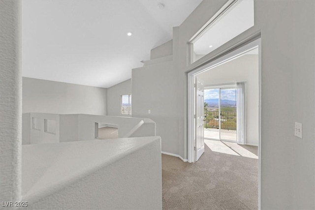 1221 Diamond Valley St, Henderson, NV 89052 - hall with an upstairs landing, carpet floors, healthy amount of natural light, vaulted ceiling, and baseboards