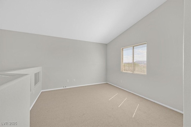 1221 Diamond Valley St, Henderson, NV 89052 - empty room featuring vaulted ceiling, carpet floors, and baseboards
