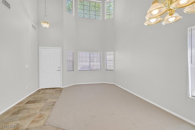 1221 Diamond Valley St, Henderson, NV 89052 - entryway with a high ceiling, a chandelier, baseboards, and carpet