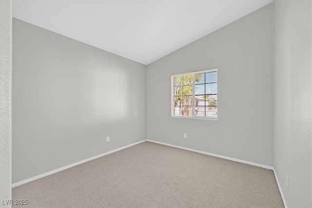1221 Diamond Valley St, Henderson, NV 89052 - spare room featuring lofted ceiling, carpet, and baseboards