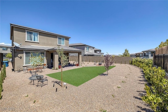 12429 Alpenglow Ct, Las Vegas, NV 89138 - rear view of property featuring a fenced backyard, stucco siding, and a patio area