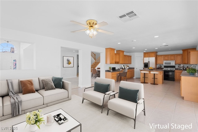5396 Valley Wells Way, Las Vegas, NV 89113 - living area featuring stairs, light tile patterned floors, ceiling fan, and recessed lighting