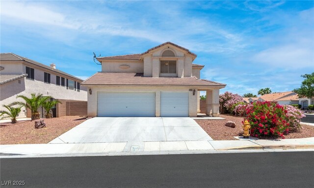 5396 Valley Wells Way, Las Vegas, NV 89113 - view of front of property with a garage, concrete driveway, stucco siding, and a tiled roof