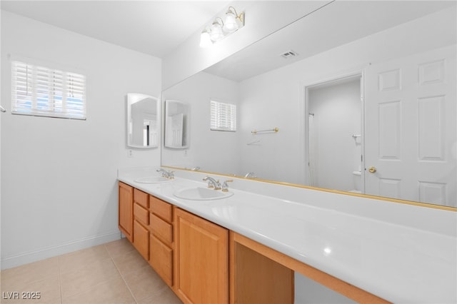 5396 Valley Wells Way, Las Vegas, NV 89113 - full bathroom with double vanity, tile patterned flooring, toilet, and plenty of natural light