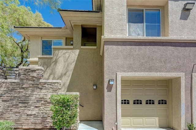 701 Peachy Canyon Cir Unit 201, Las Vegas, NV 89144 - entrance to property featuring stucco siding and a garage