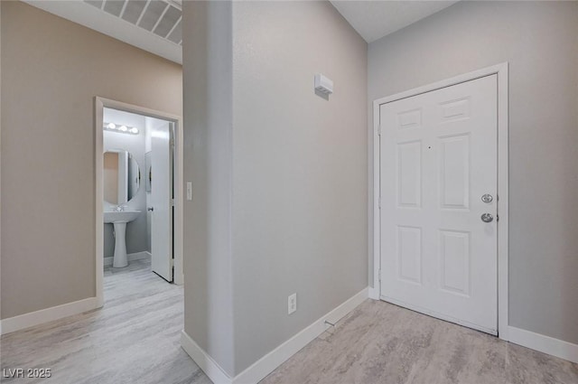 701 Peachy Canyon Cir Unit 201, Las Vegas, NV 89144 - foyer featuring baseboards and wood finished floors
