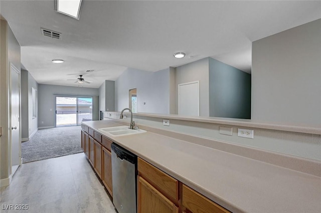 701 Peachy Canyon Cir Unit 201, Las Vegas, NV 89144 - kitchen with stainless steel dishwasher, a sink, open floor plan, brown cabinetry, and ceiling fan
