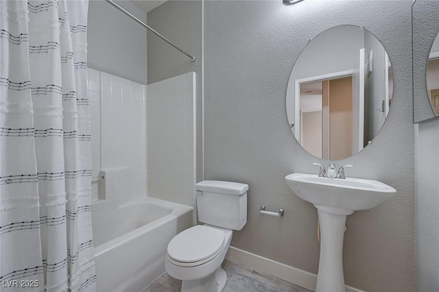 701 Peachy Canyon Cir Unit 201, Las Vegas, NV 89144 - bathroom featuring baseboards, toilet, shower / bath combo, and a sink