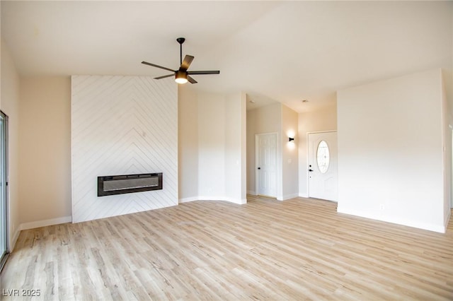 unfurnished living room with a ceiling fan, a fireplace, light wood-style flooring, and baseboards