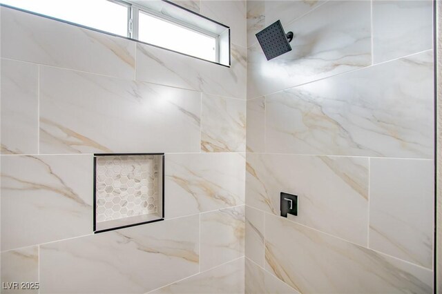 full bath featuring tiled shower