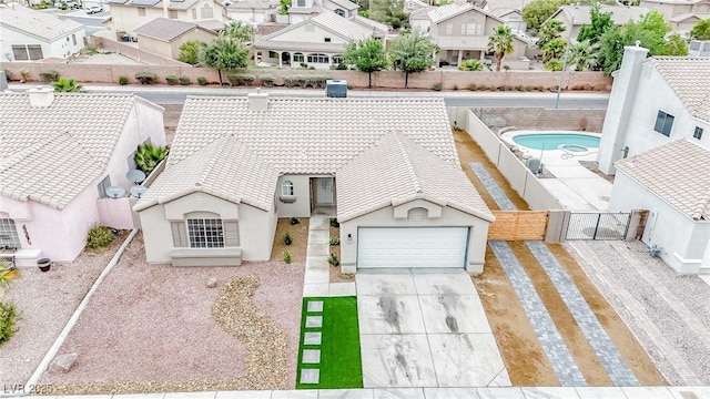 aerial view of residential area featuring a pool area