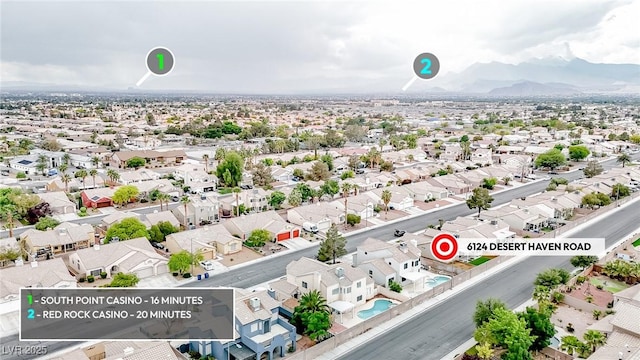 aerial perspective of suburban area featuring a mountainous background