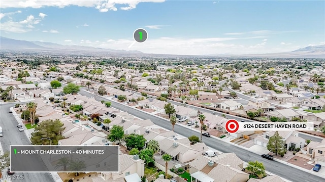 aerial view of residential area featuring a mountain backdrop