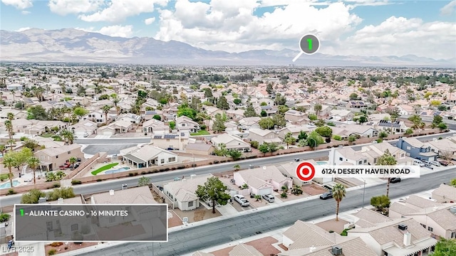 aerial perspective of suburban area featuring a mountainous background