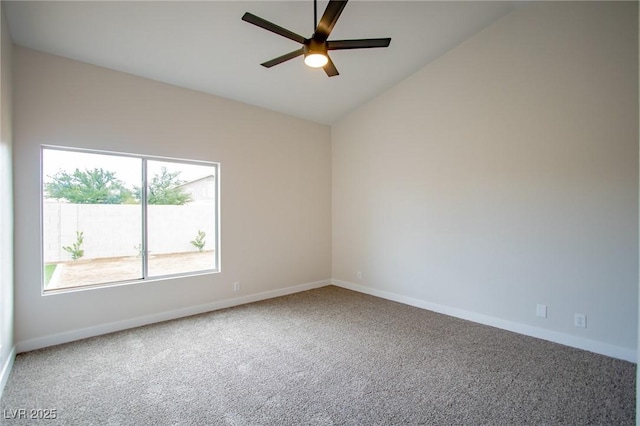 carpeted spare room with a ceiling fan, baseboards, and lofted ceiling