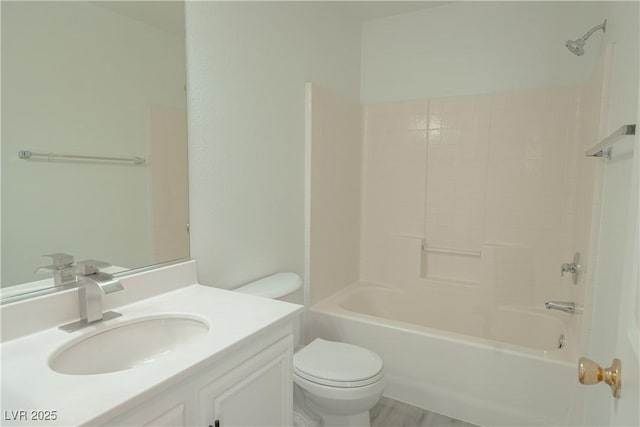 bathroom featuring toilet, vanity, and shower / bath combination
