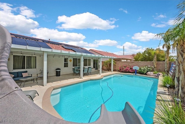 view of pool featuring a fenced backyard, a patio area, outdoor dining area, and an outdoor living space