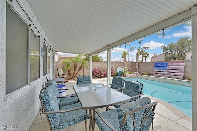 view of patio with a fenced backyard and outdoor dining area