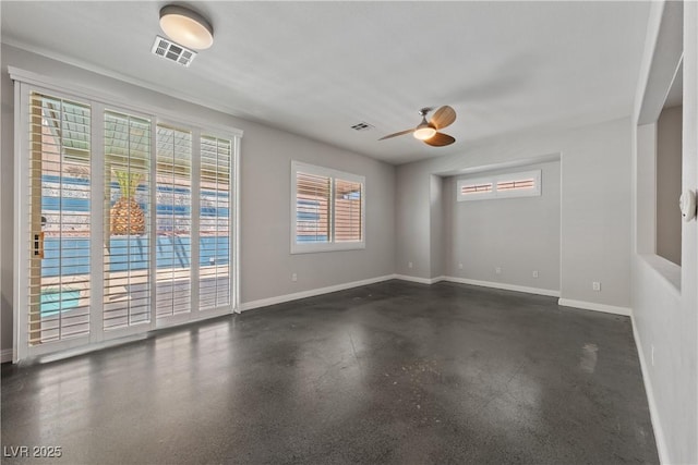 spare room with baseboards and ceiling fan