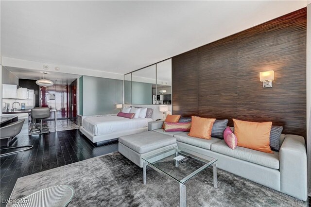 4381 W Flamingo Rd Unit 3206, Las Vegas, NV 89103 - living room with dark wood-style flooring