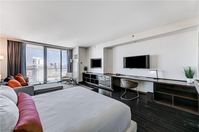 4381 W Flamingo Rd Unit 3206, Las Vegas, NV 89103 - bedroom with floor to ceiling windows and wood finished floors
