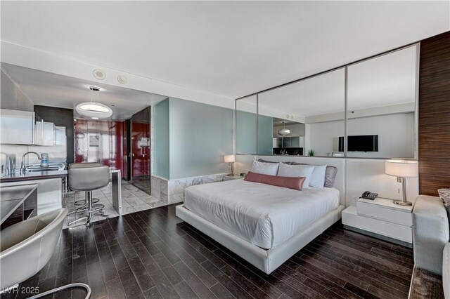 4381 W Flamingo Rd Unit 3206, Las Vegas, NV 89103 - bedroom with wood finished floors and a sink