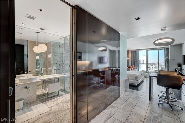 4381 W Flamingo Rd Unit 3206, Las Vegas, NV 89103 - bathroom with marble finish floors