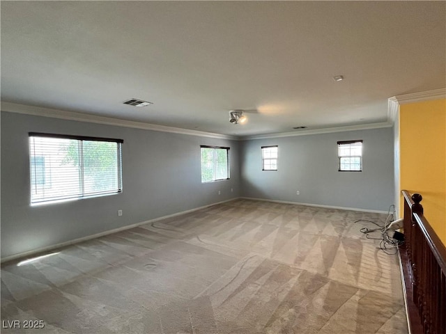 2112 Merganser Ct, North Las Vegas, NV 89084 - unfurnished room featuring crown molding, light colored carpet, plenty of natural light, and baseboards